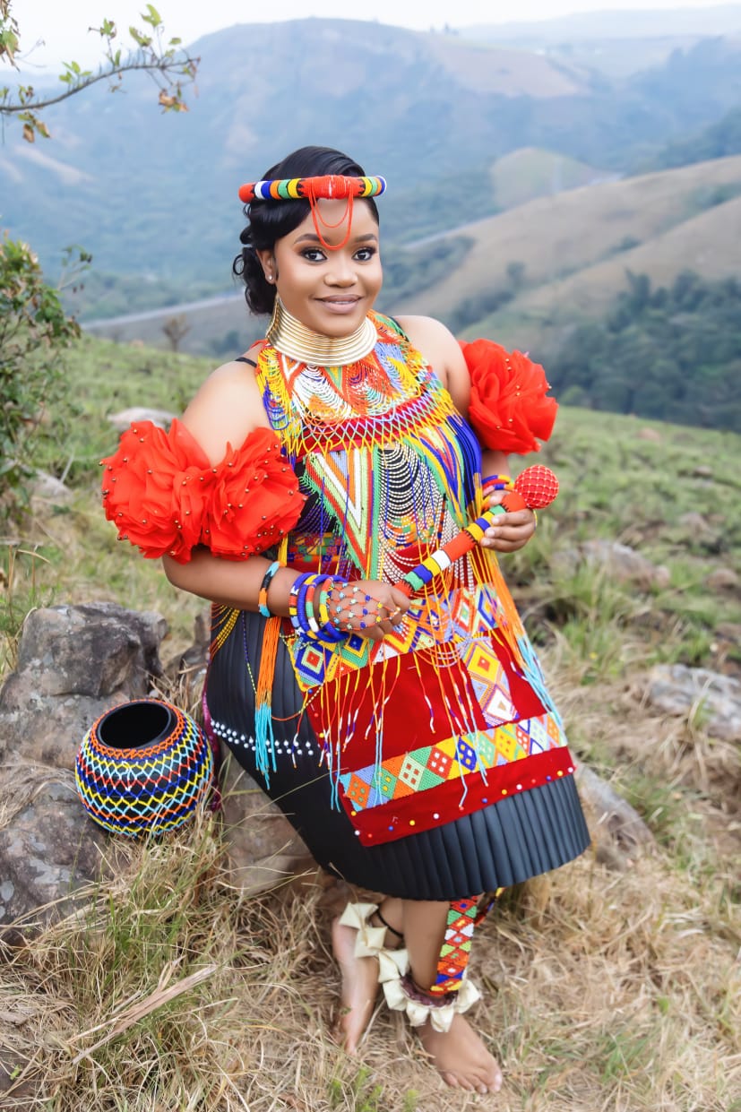 Full-length portrait of Hlengiwe in traditional attire