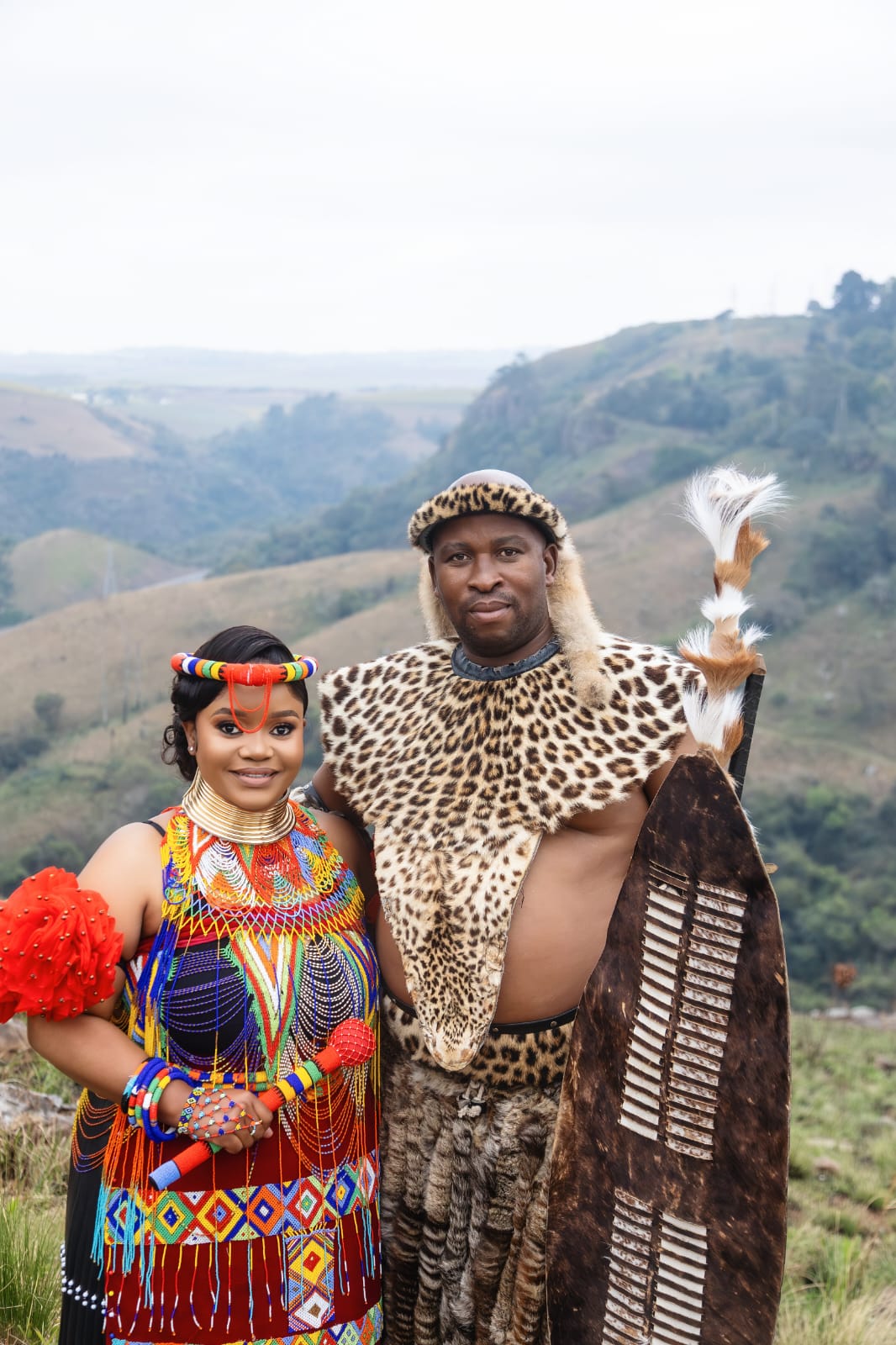 Lizwe and Hlengiwe standing together in traditional attire
